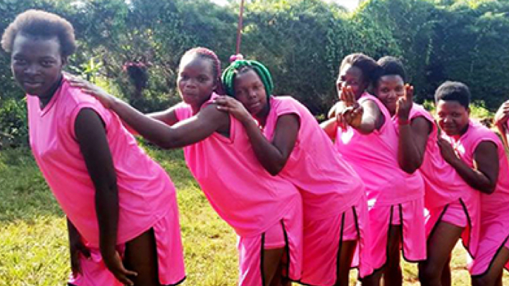 Young women in Africa wearing pink clothing 